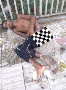 A vulnerable brother lying on the pavement in Dhaka.